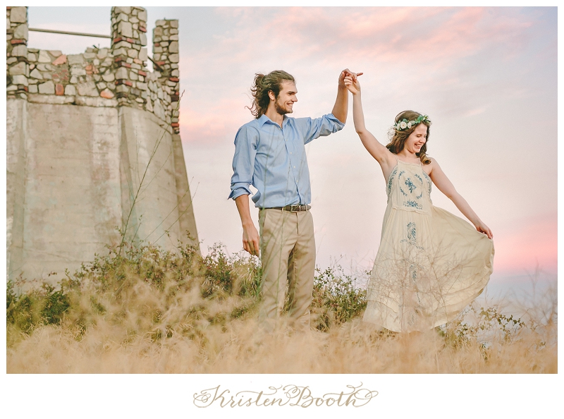 Fairytale twirling engagement photo at a castle in the sky