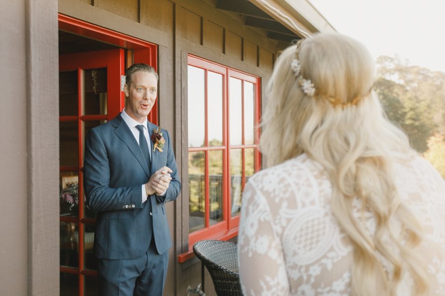 Groom's reaction to first look during coastal california elopement wedding