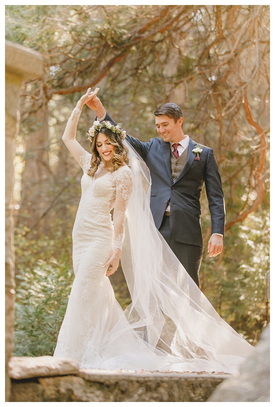 Romantic twirling photo of bride and groom in the Southern California forest