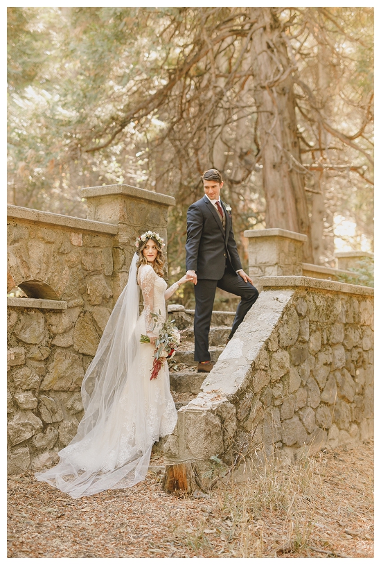 Couple on a stone staircase in the woods