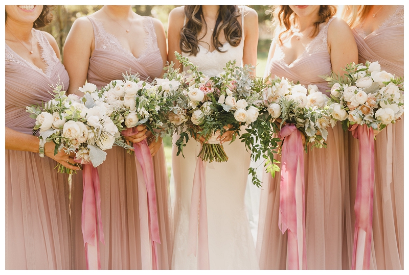 Lush bouquets with mauve and blush ribbons