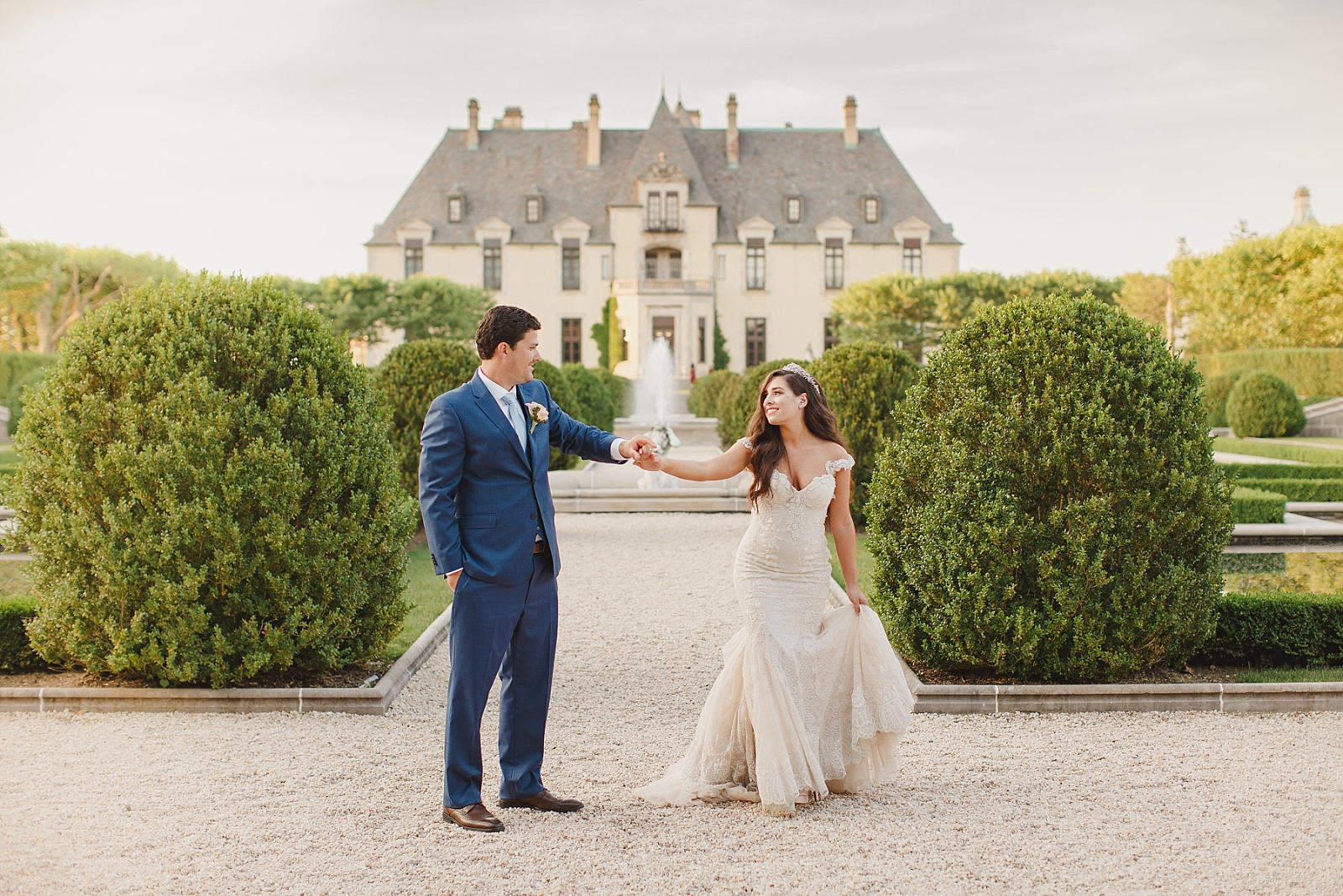 Fairytale portrait of couple dancing in front of Oheka Castle in Long Island NY
