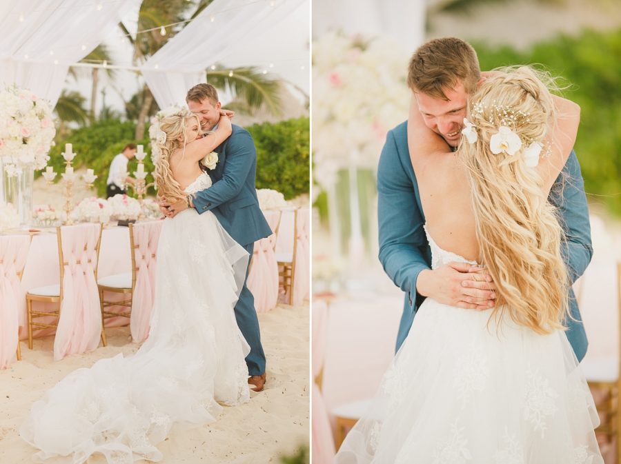 Bride and groom doing their first dance in the sand on the beach