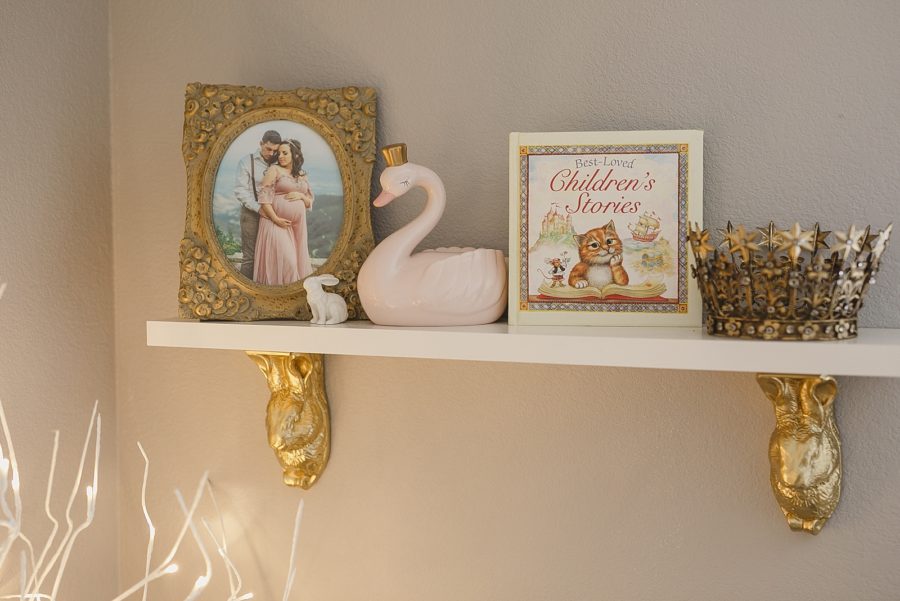 Fairytale shelf in baby girl nursery
