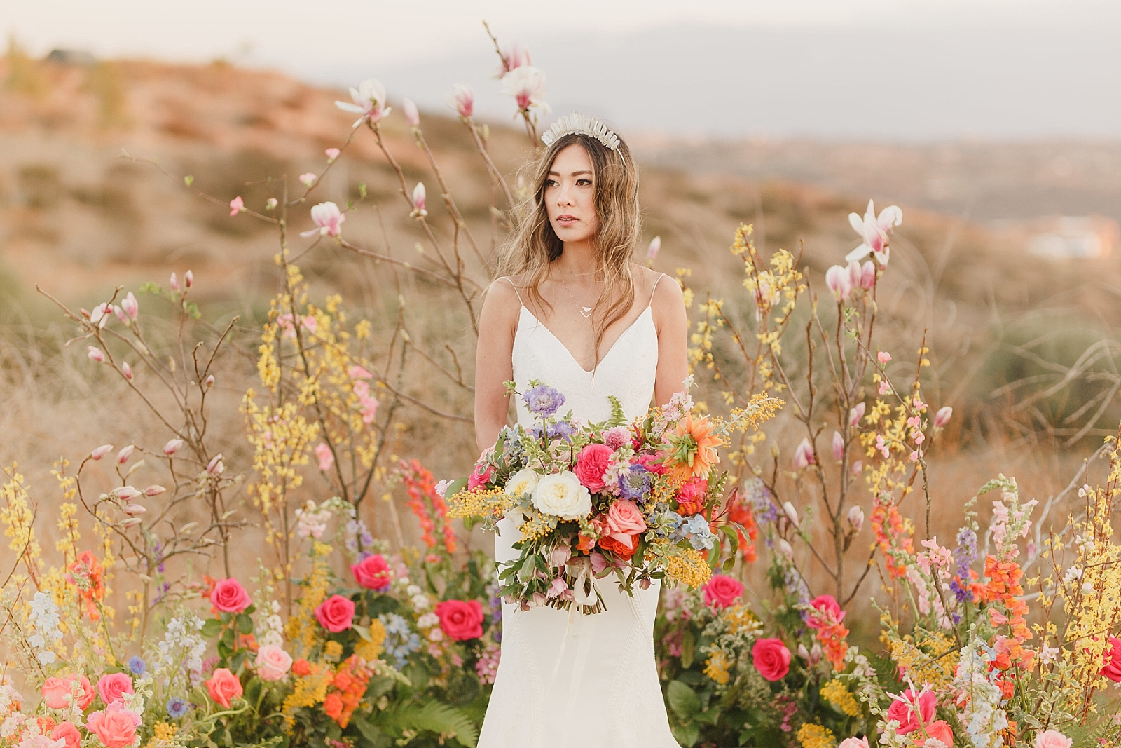 Bride standing at altar for whimsical desert wedding in California