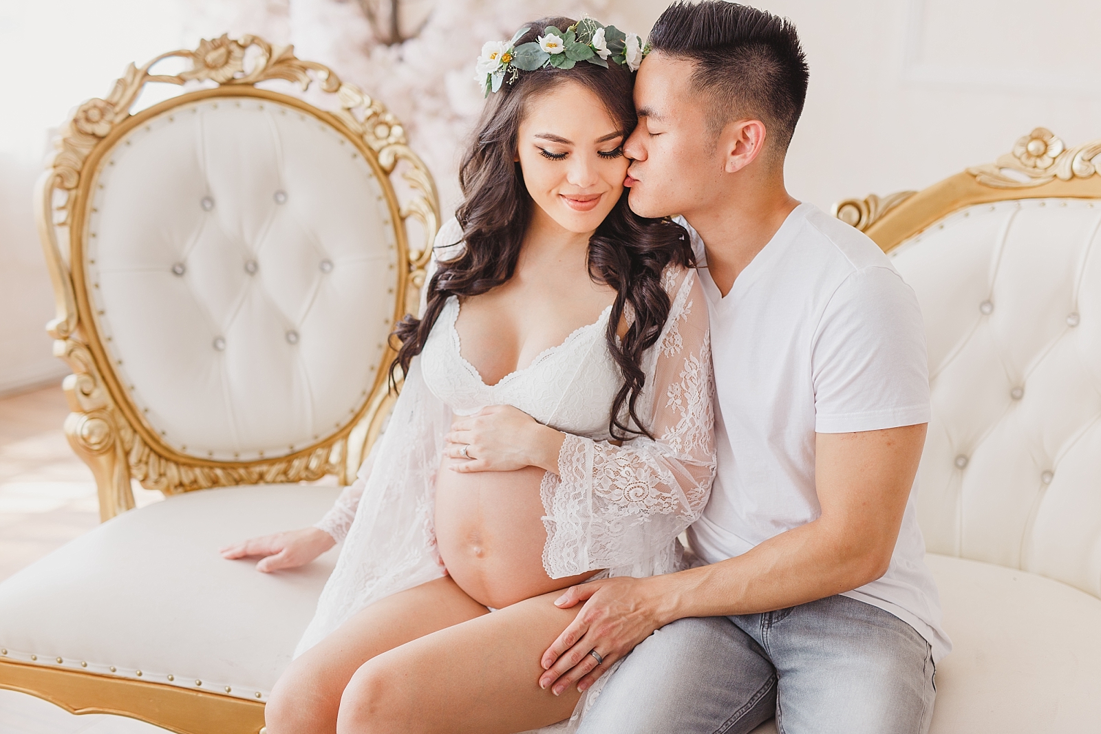 Studio maternity photos on vintage couch with flower crown